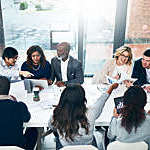 Shot of a group of diverse businesspeople having a meeting in a modern office