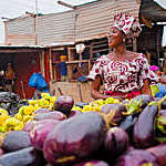 African woman selling vegetables on the market in Bamako, Mali.