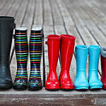 Five pairs of a colorful rain boots. Family concept
