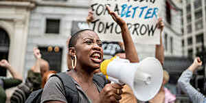 Activists doing a demonstration outdoors